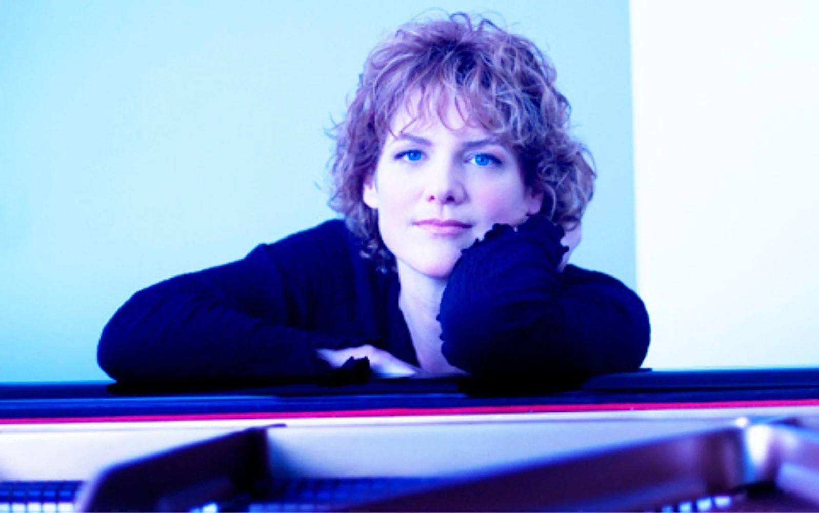 Laura Caviani poses with piano