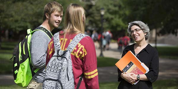 Coe Students Talking to Teacher