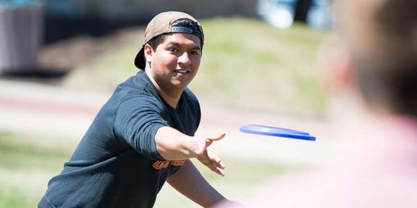 Coe Student Throwing A Frisbee