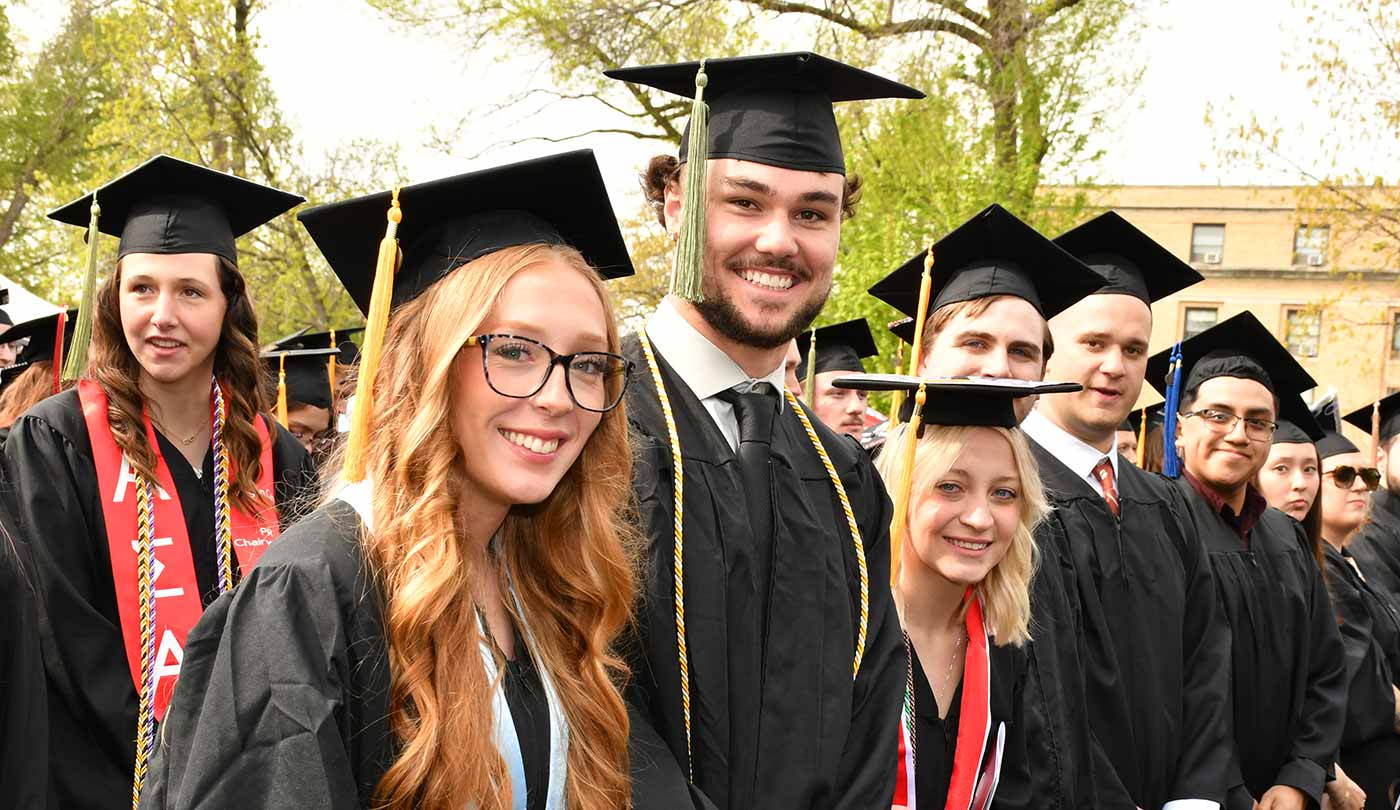 Group-of-graduates-smiling-to-camera.jpg