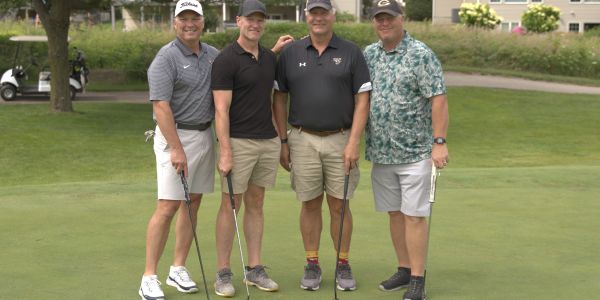 Three students in a classroom