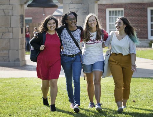 Students walking away from the victory bell