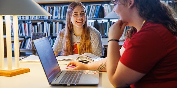 Coe students studying in the library